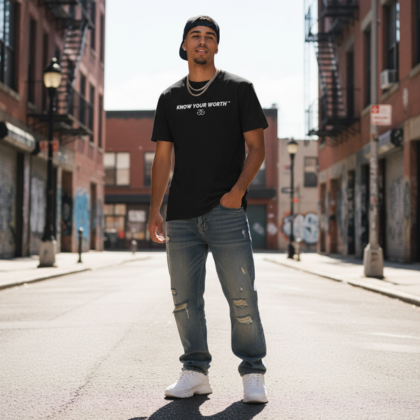 Male model wearing black Gordz Grayson Know Your Worth™ Premium Tee – front view with logo text “Know Your Worth” across chest.
