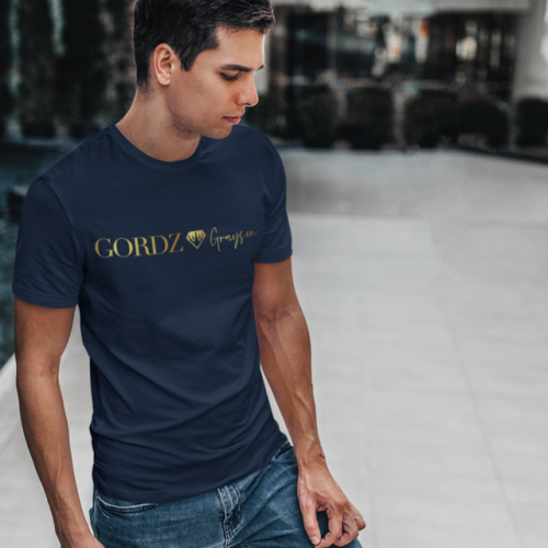 t shirt mockup featuring a man standing by a modern fountain 428 el 50