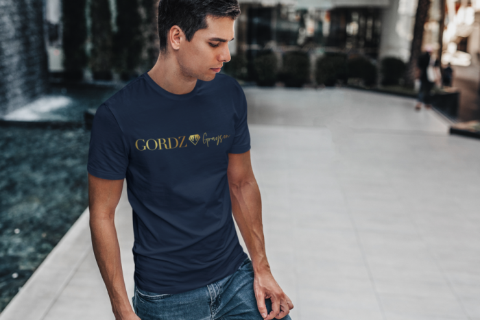 t shirt mockup featuring a man standing by a modern fountain 428 el 50