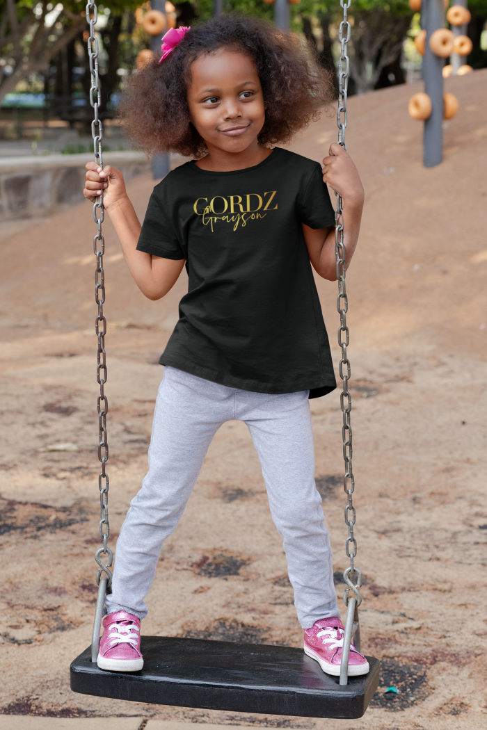 t shirt mockup of a playful girl standing on a swing 32179